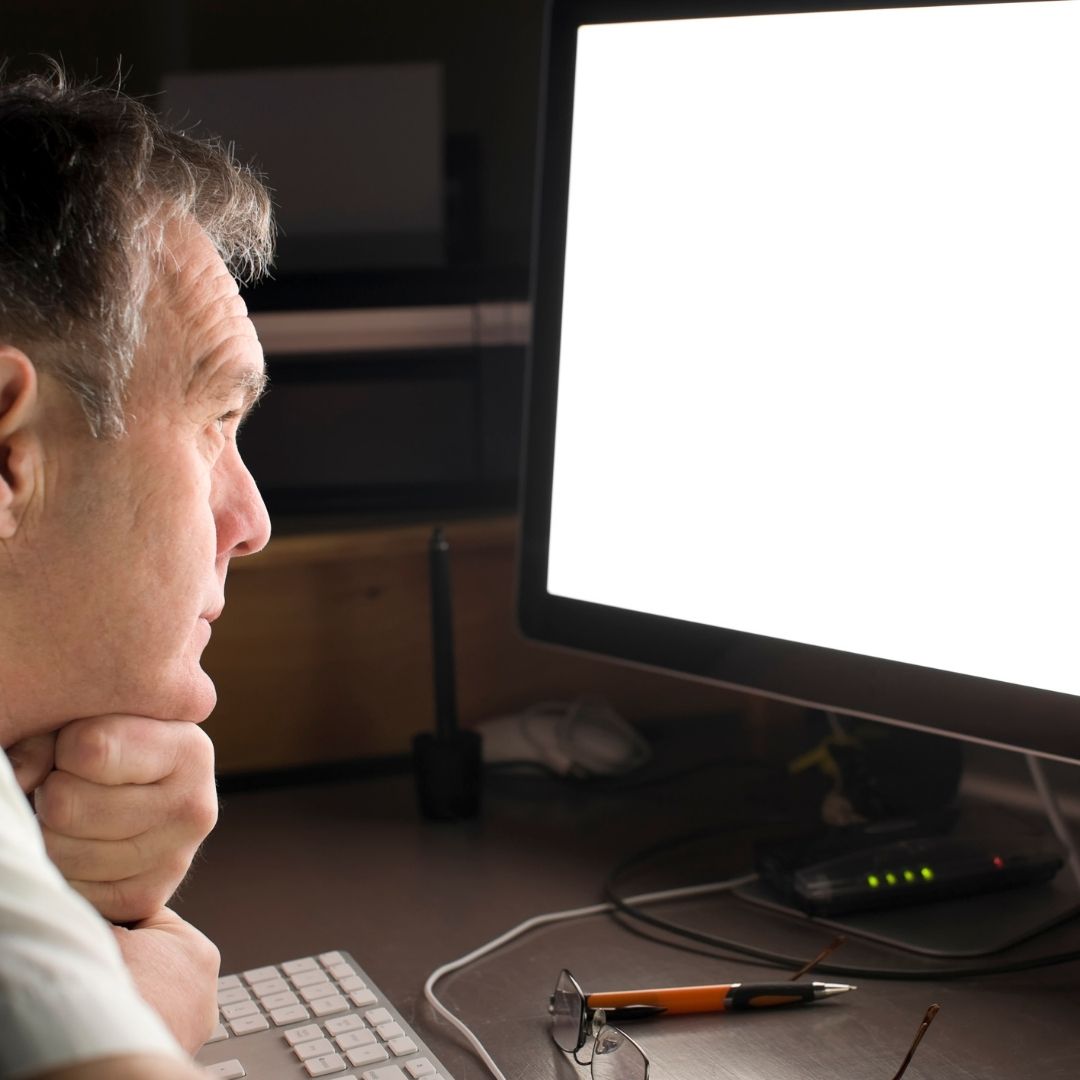 man staring at a blank white screen